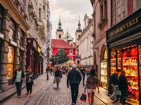 a vibrant urban neighborhood with shops and people walking