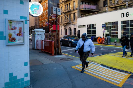 a lively street in New York City with people walking