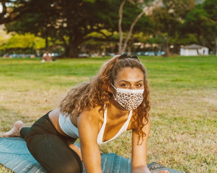 people practicing yoga in a park